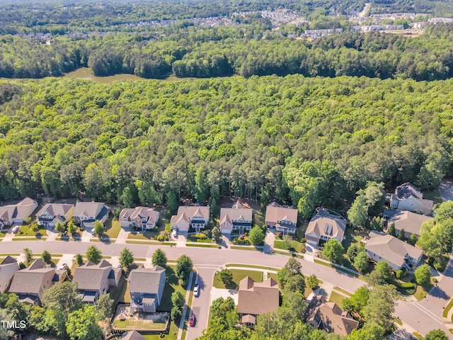 bird's eye view with a residential view and a wooded view