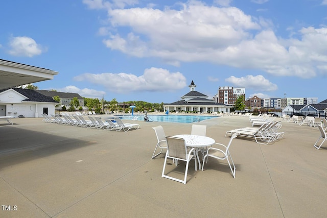 view of patio featuring a community pool