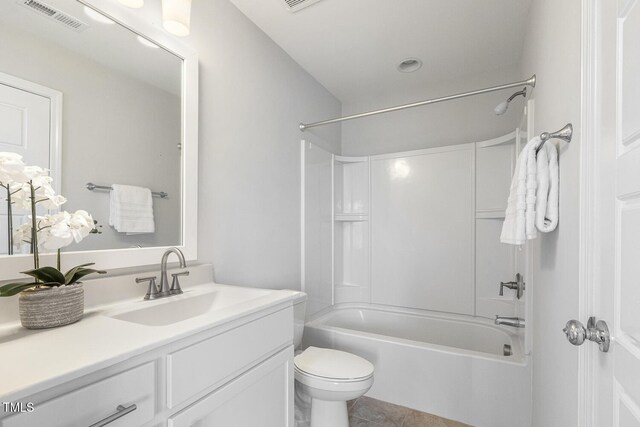 bathroom with visible vents, tile patterned flooring, shower / washtub combination, vanity, and toilet