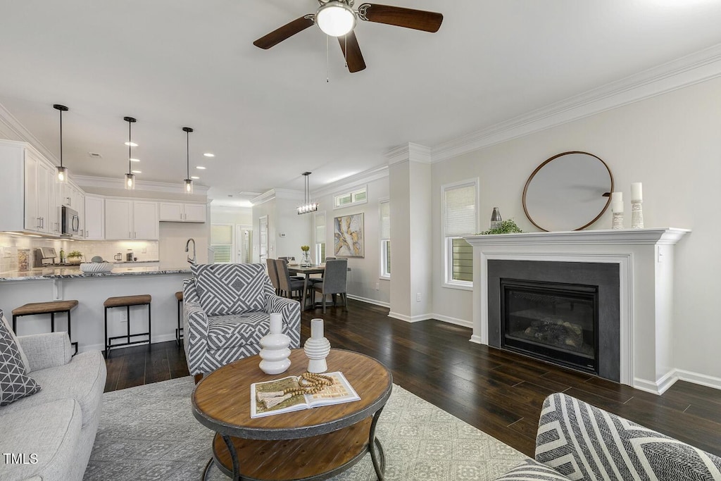 1211 Brown Velvet Ln, Apex, NC 27523 - living area featuring ceiling fan, a glass covered fireplace, recessed lighting, baseboards, and dark wood-style floors