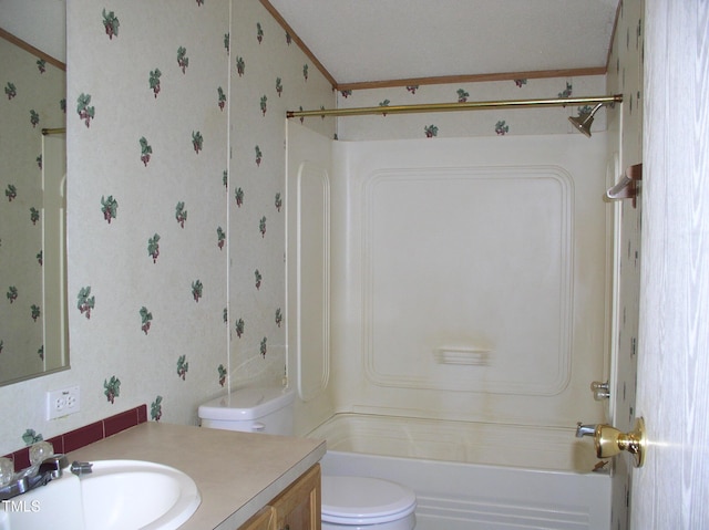 bathroom with toilet, wallpapered walls, tub / shower combination, and vanity