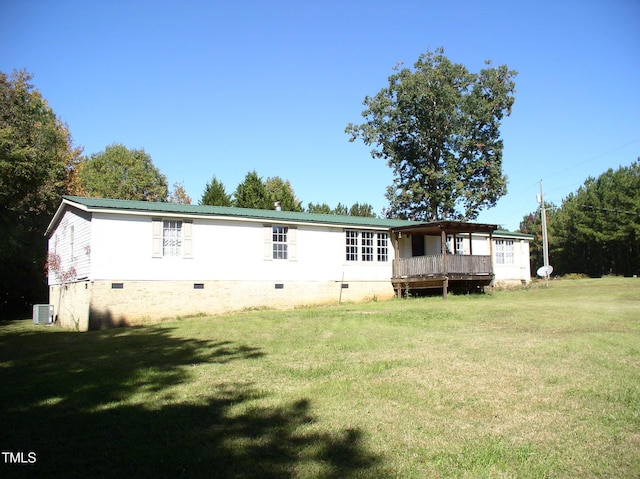 view of front of property with central air condition unit, crawl space, metal roof, and a front lawn