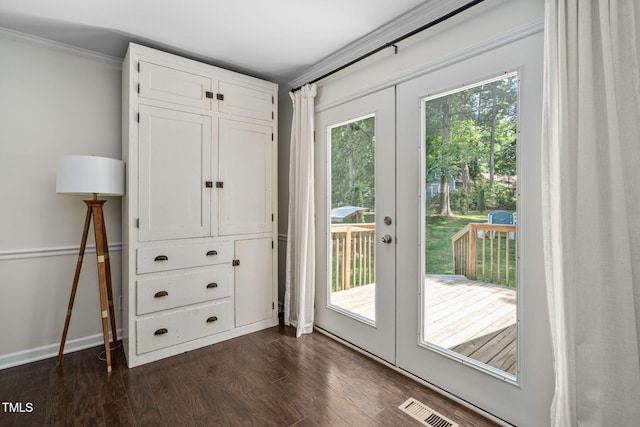 entryway with french doors, visible vents, baseboards, dark wood-style floors, and ornamental molding