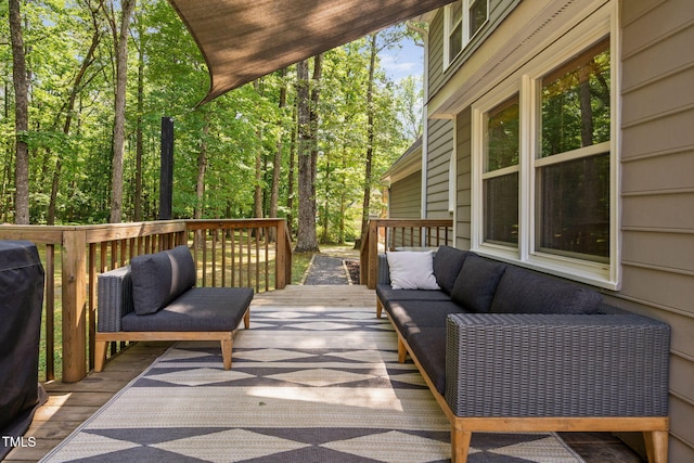 wooden deck with an outdoor living space
