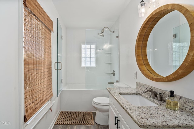 bathroom with vanity, shower / bathing tub combination, and toilet
