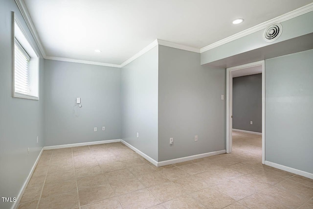 unfurnished room with crown molding, baseboards, and light tile patterned floors
