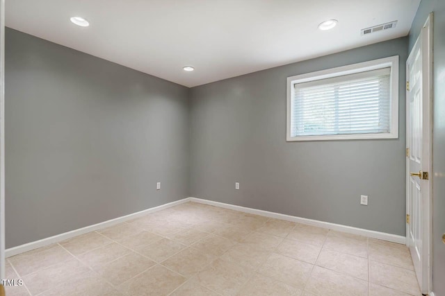 unfurnished room with recessed lighting, baseboards, visible vents, and light tile patterned floors