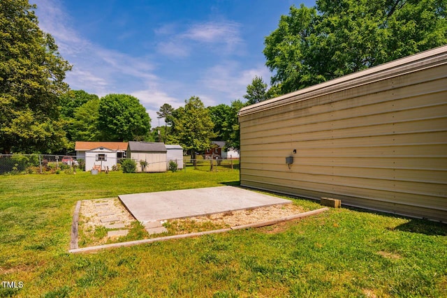 view of yard with fence and a patio area