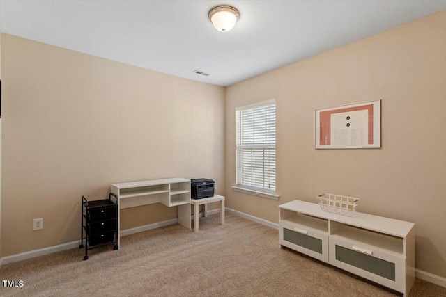 misc room with carpet flooring, baseboards, and visible vents