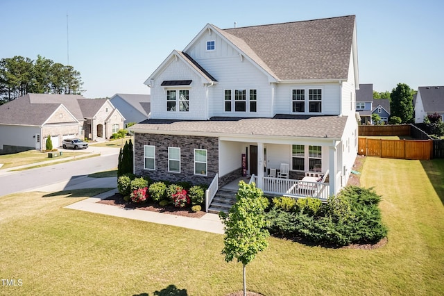 536 Adkins Ridge Rd, Rolesville, NC 27571 - view of front of property featuring roof with shingles, fence, covered porch, and a front lawn