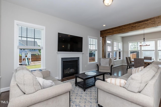 536 Adkins Ridge Rd, Rolesville, NC 27571 - living room featuring an inviting chandelier, a fireplace, recessed lighting, baseboards, and wood finished floors