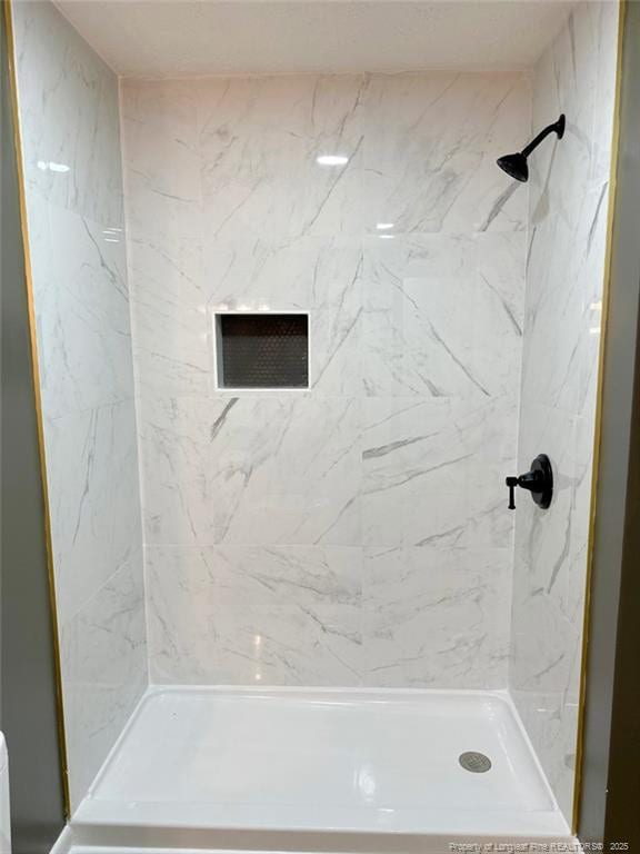 bathroom featuring a shower stall