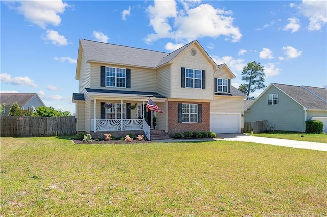 traditional-style home with fence, an attached garage, a front lawn, a porch, and driveway