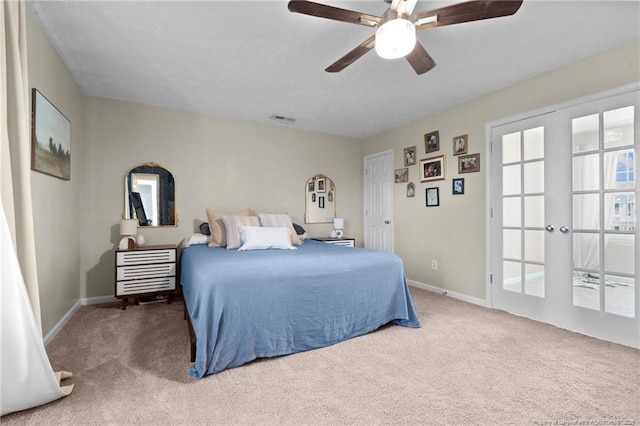bedroom featuring carpet flooring, a ceiling fan, baseboards, and visible vents
