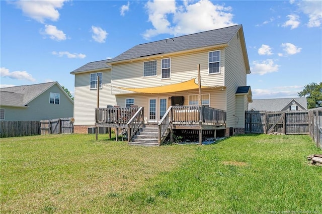 back of house with a lawn, a fenced backyard, and a wooden deck