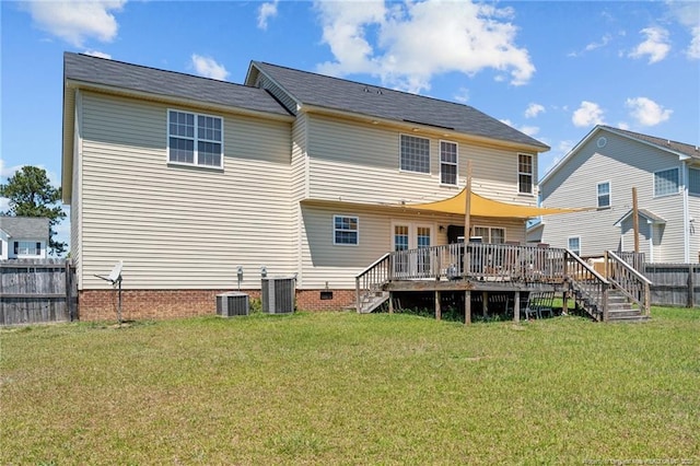 rear view of house with fence, stairs, a yard, and a deck