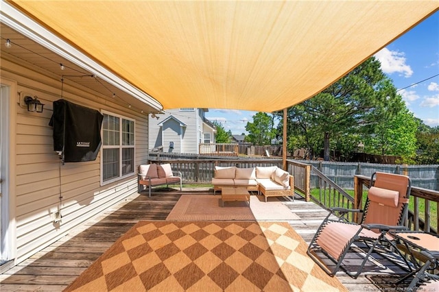 view of patio featuring a fenced backyard, a wooden deck, and outdoor lounge area