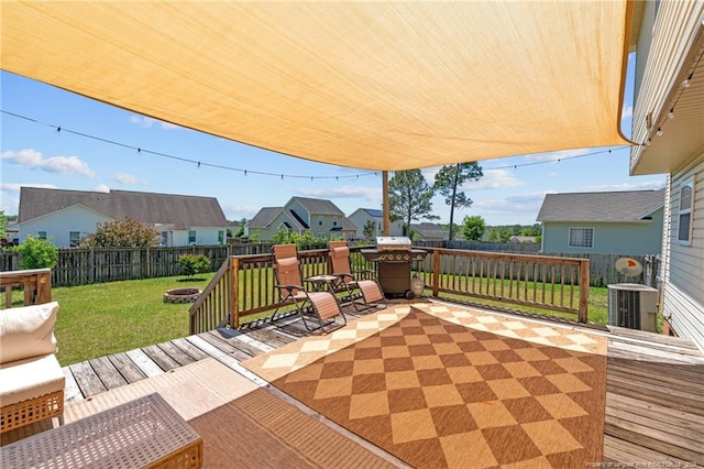 view of patio with a fenced backyard, a wooden deck, central AC unit, and a residential view
