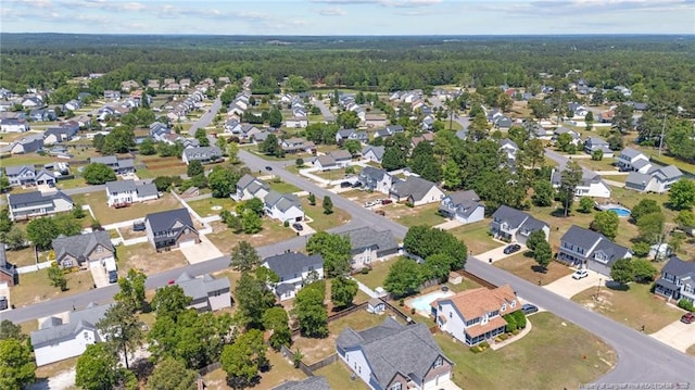 bird's eye view with a residential view and a view of trees