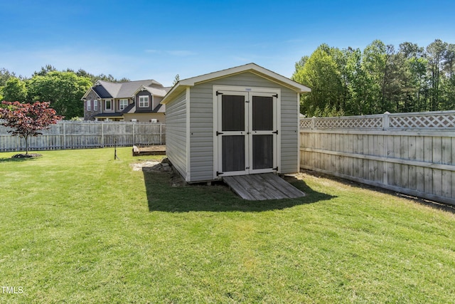 view of shed with a fenced backyard