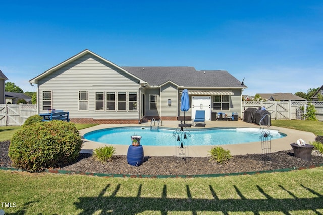 view of pool featuring a fenced backyard, a gate, and a yard