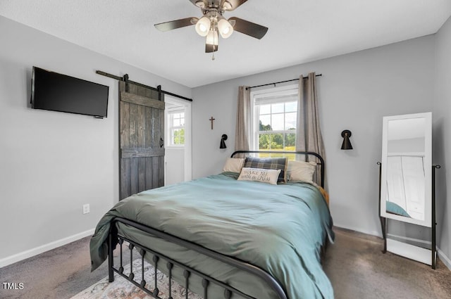 640 Short Journey Rd, Smithfield, NC 27577 - carpeted bedroom with baseboards, a barn door, and ceiling fan