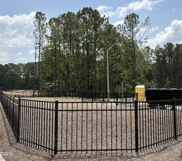5906 Dunzo Dr, Raleigh, NC 27617 - gate featuring a forest view