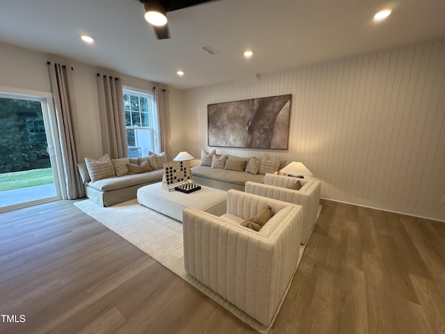 5906 Dunzo Dr, Raleigh, NC 27617 - living area with wood finished floors, ceiling fan, and recessed lighting