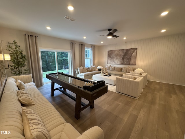 5906 Dunzo Dr, Raleigh, NC 27617 - living area featuring wood finished floors, ceiling fan, and recessed lighting