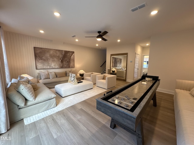 5906 Dunzo Dr, Raleigh, NC 27617 - living room with wood finished floors, recessed lighting, stairway, and ceiling fan