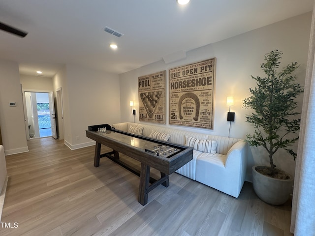 5906 Dunzo Dr, Raleigh, NC 27617 - living area with wood finished floors and recessed lighting