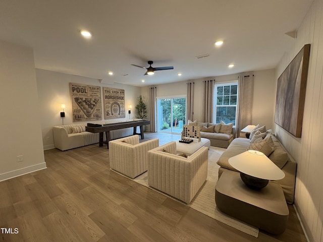 5906 Dunzo Dr, Raleigh, NC 27617 - living area featuring ceiling fan, wood finished floors, and recessed lighting
