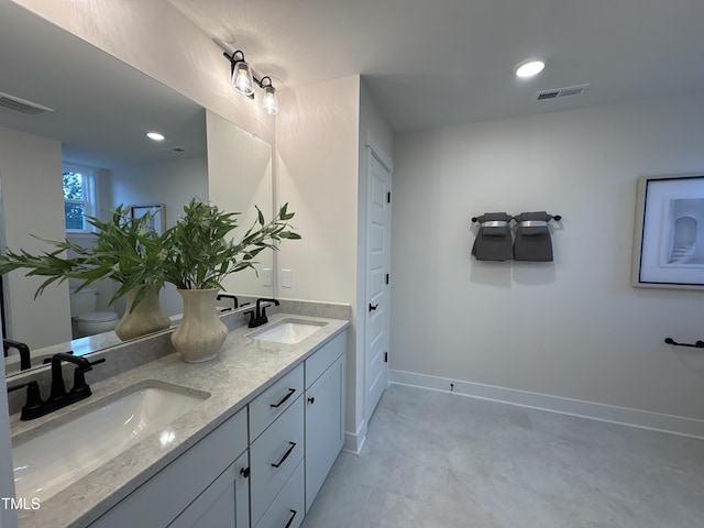 5906 Dunzo Dr, Raleigh, NC 27617 - full bath featuring double vanity and recessed lighting