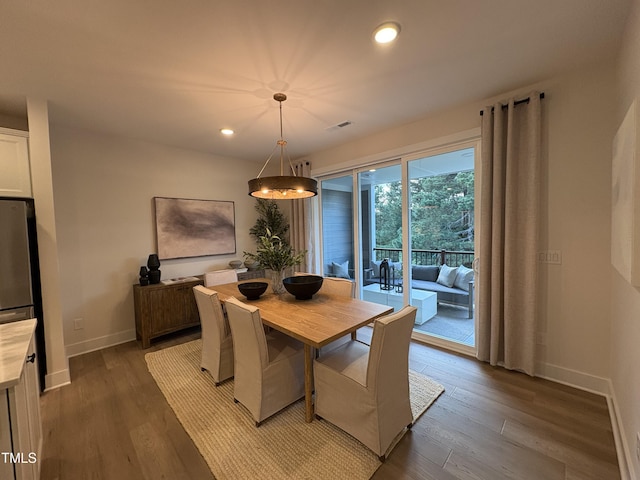 5906 Dunzo Dr, Raleigh, NC 27617 - dining space featuring wood finished floors, recessed lighting, and a chandelier