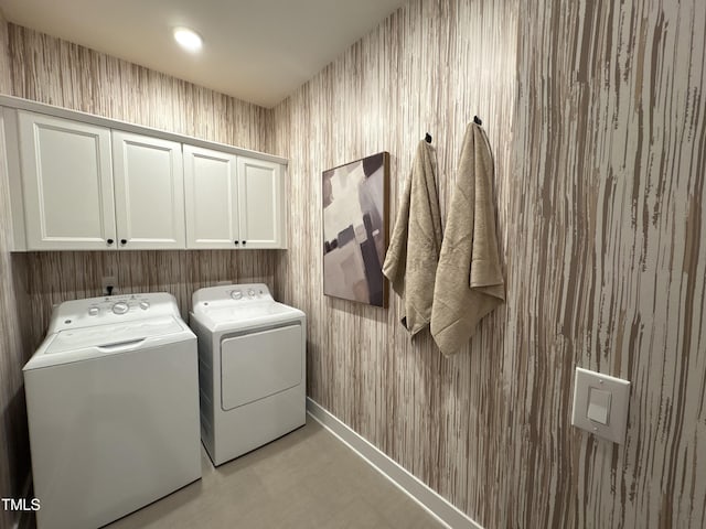 5906 Dunzo Dr, Raleigh, NC 27617 - laundry area with washing machine and dryer and cabinet space