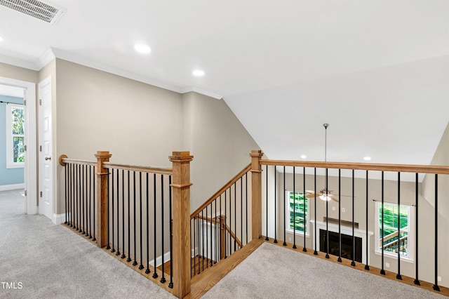 staircase with ceiling fan, visible vents, ornamental molding, carpet flooring, and recessed lighting