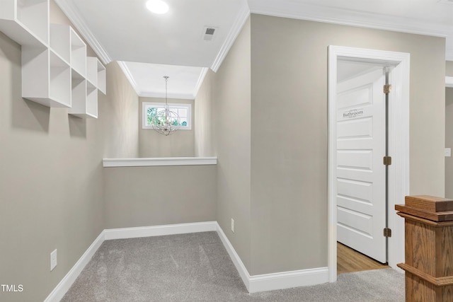 interior space featuring visible vents, carpet, and a chandelier
