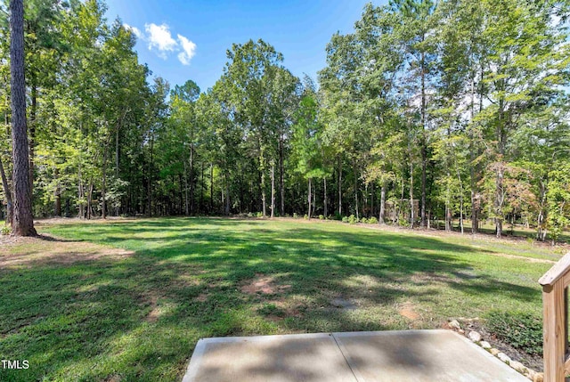 view of yard with a forest view