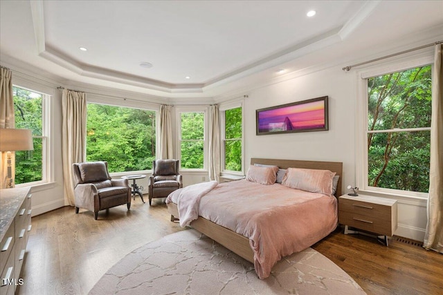 3601 Nightfall Ct, Raleigh, NC 27607 - bedroom featuring a raised ceiling, wood finished floors, and crown molding