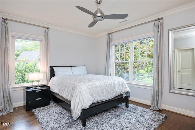 3601 Nightfall Ct, Raleigh, NC 27607 - bedroom featuring multiple windows, dark wood-style floors, ornamental molding, baseboards, and ceiling fan