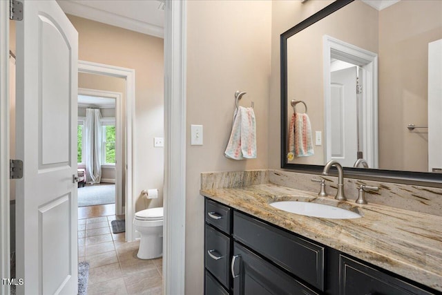 3601 Nightfall Ct, Raleigh, NC 27607 - bathroom featuring vanity, toilet, tile patterned flooring, and crown molding