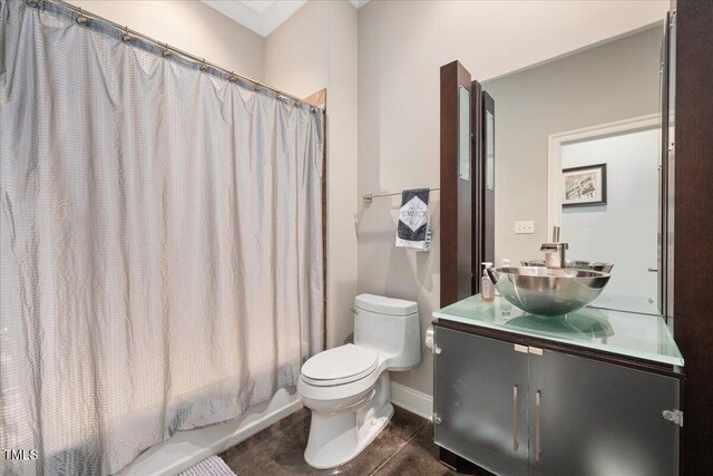 3601 Nightfall Ct, Raleigh, NC 27607 - bathroom with toilet, vanity, baseboards, and shower / tub combo with curtain