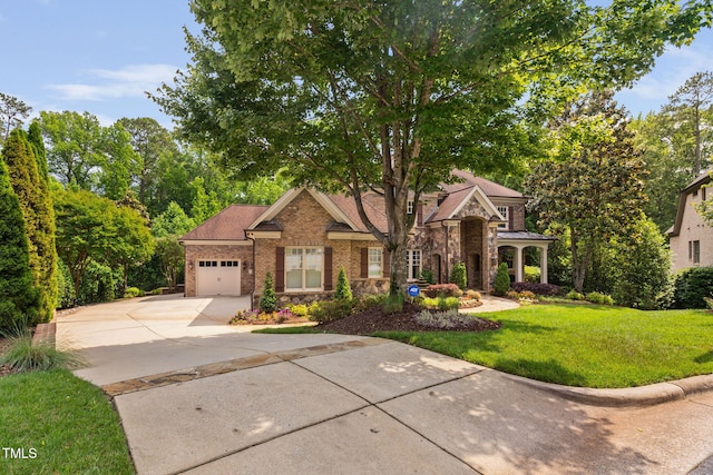3601 Nightfall Ct, Raleigh, NC 27607 - view of front of house with driveway, stone siding, an attached garage, a front lawn, and brick siding