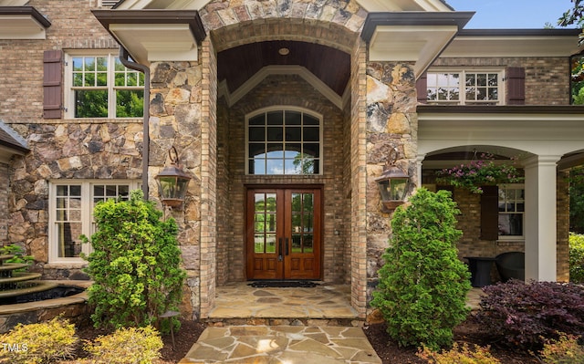 3601 Nightfall Ct, Raleigh, NC 27607 - entrance to property with french doors and stone siding