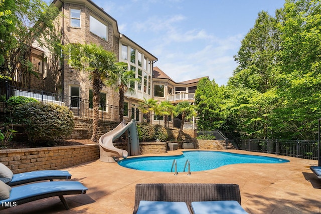 3601 Nightfall Ct, Raleigh, NC 27607 - view of pool with a water slide, stairway, a patio area, and fence