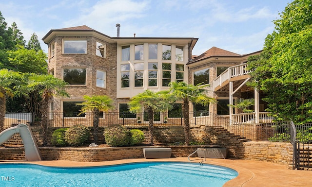 3601 Nightfall Ct, Raleigh, NC 27607 - view of swimming pool with stairway, a water slide, and fence