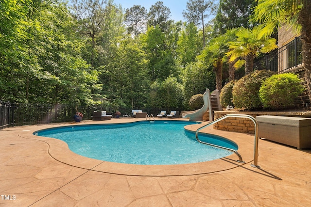 3601 Nightfall Ct, Raleigh, NC 27607 - view of pool with a patio area, a water slide, and fence