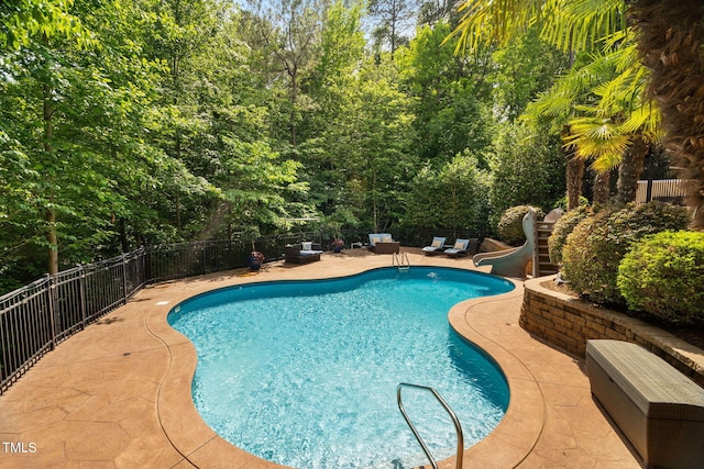 3601 Nightfall Ct, Raleigh, NC 27607 - view of pool featuring a water slide, a patio area, and fence