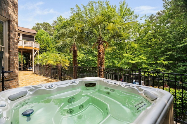 3601 Nightfall Ct, Raleigh, NC 27607 - view of patio featuring view of scattered trees, fence, a hot tub, and a balcony
