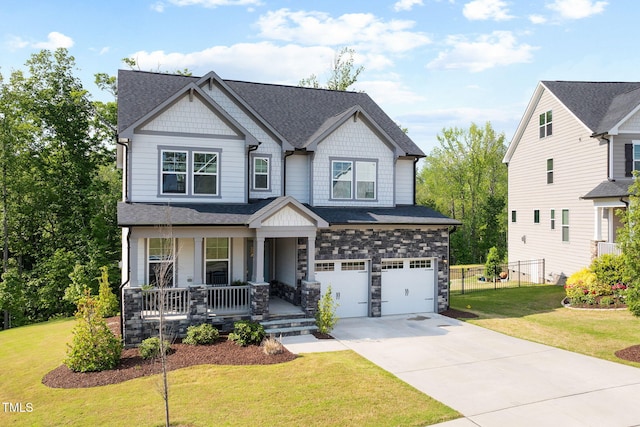 521 Marion Hills Way, Knightdale, NC 27545 - craftsman house featuring fence, a front lawn, a garage, covered porch, and driveway